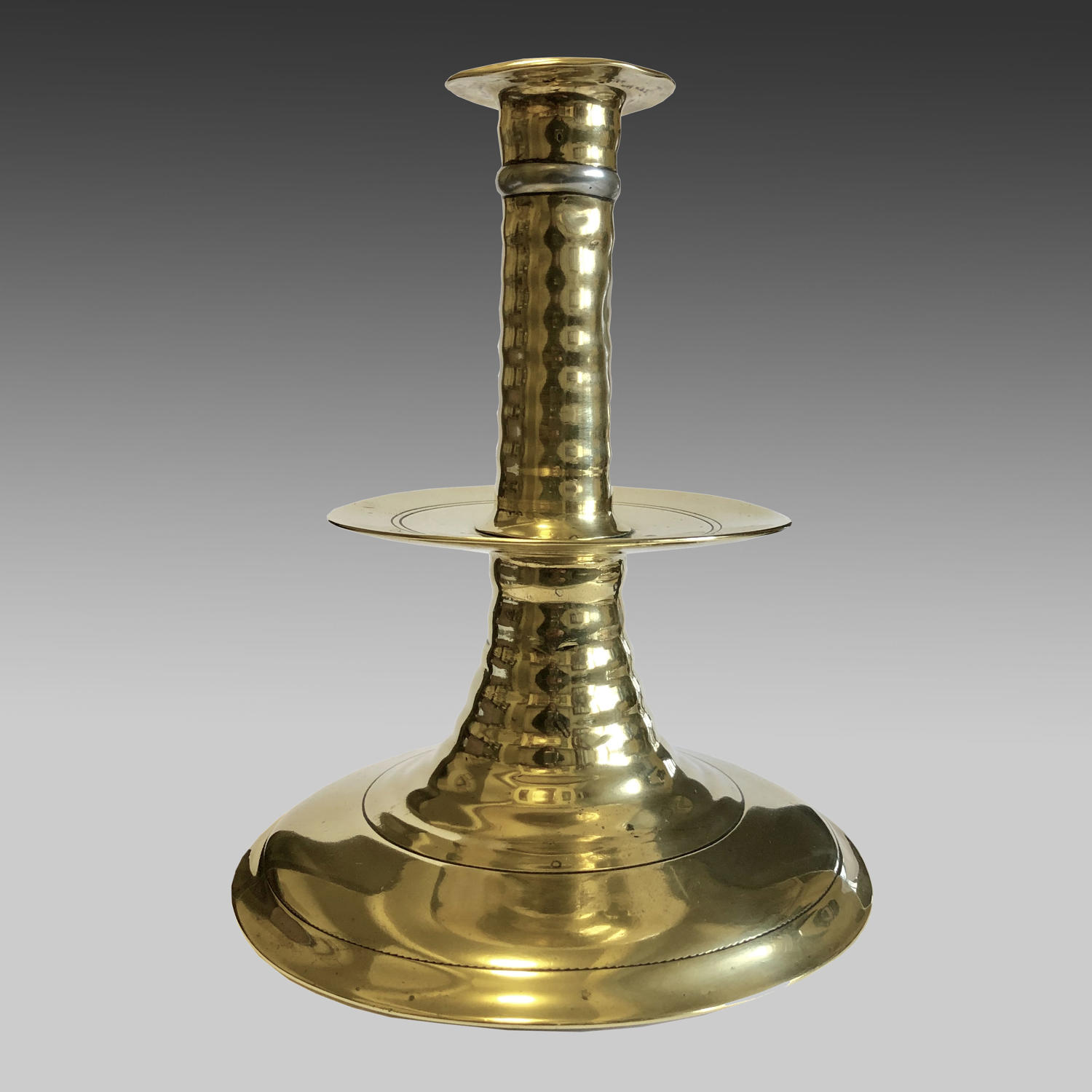 17th century brass trumpet-based candlestick