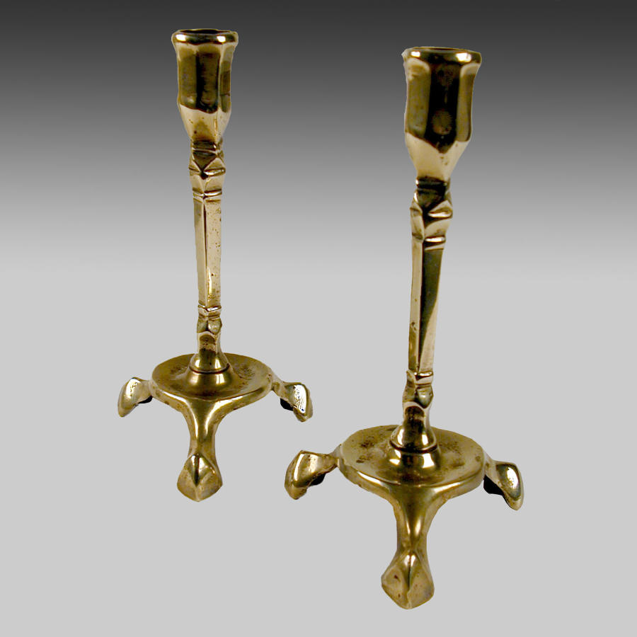 A rare pair18th century brass candlesticks