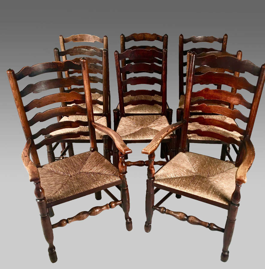 Eight rush seat antique Yorkshire ladder back chairs