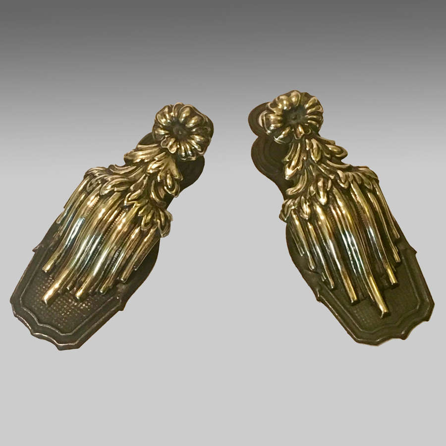 Pair of antique brass repoussé stationery clips