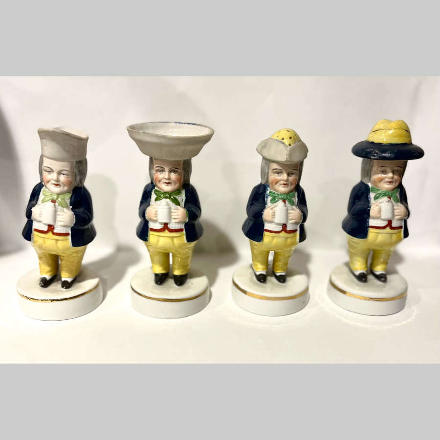 Collection of four Staffordshire toby jug men