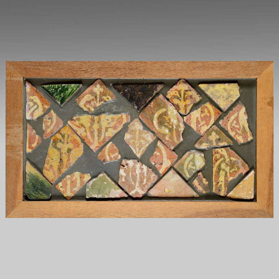 Oak framed collection of medieval encaustic tile fragments