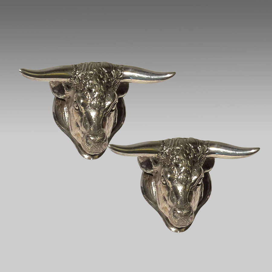 19th century pair silver electro-plate bull's head carving rests